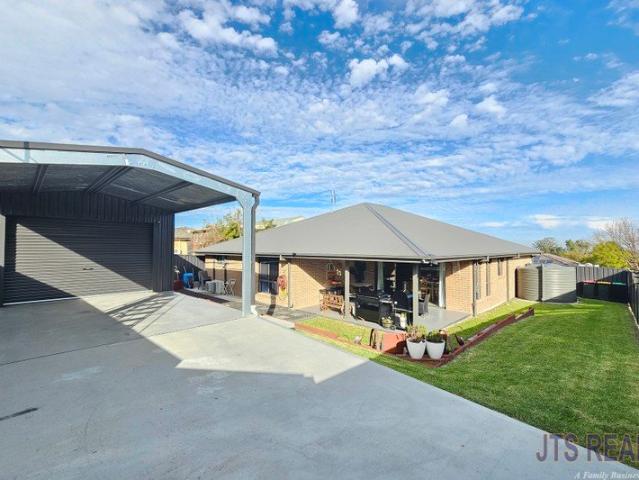 Modern Home with Huge Shed on Corner Block