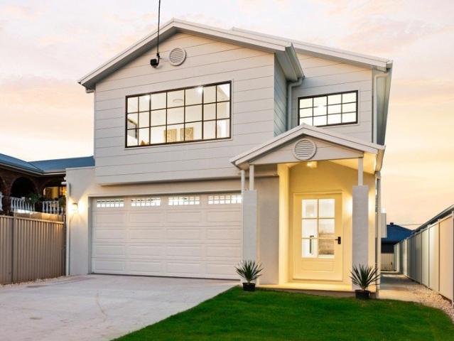 Modern Hampton style residence showcases luxurious high end features!