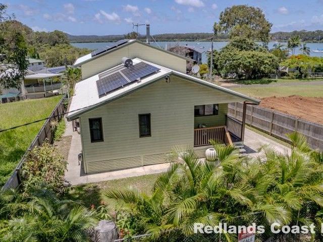 Modern Island Living with Sea Views Walk to Everything Move in Ready