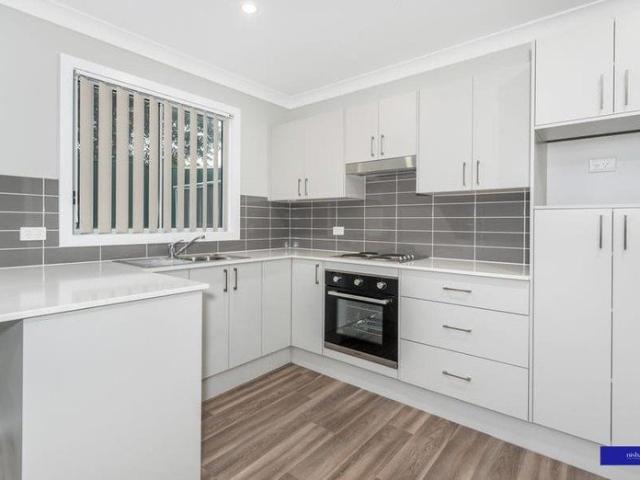 MODERN, LOW MAINTENANCE AND WATER INCLUDED