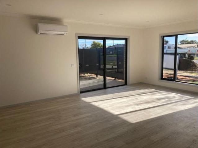 Modern, Low Maintenance Four Bedroom Home!