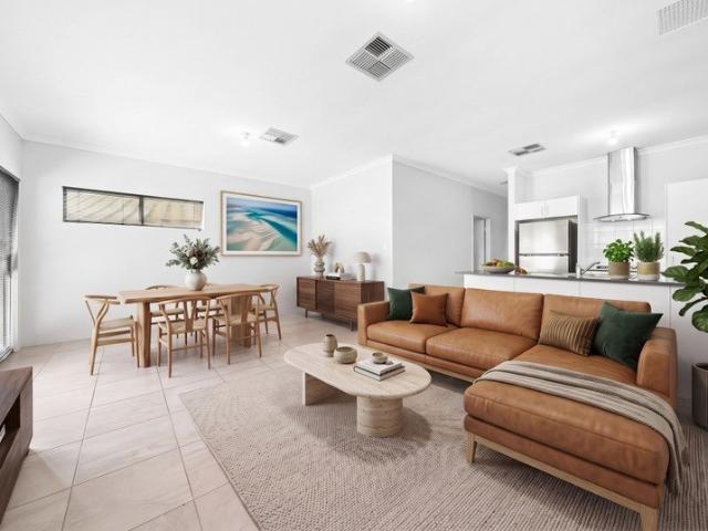 MODERN LOW MAINTENANCE LIVING WITH AN EXTRA LARGE GARAGE