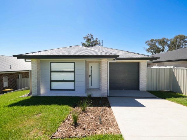 Modern, Low Maintenance Living in a Family Friendly Locale