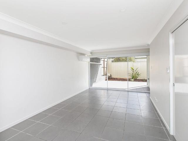 Modern & Low Maintenance Living in Convenient Booval Location