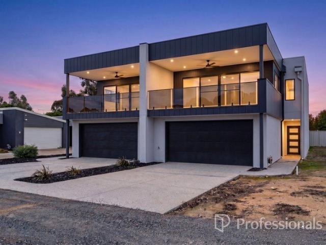 MODERN LAKESIDE LIVING WITH LOW MAINTENANCE APPEAL