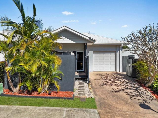 Modern living with high ceilings in a sought after location!