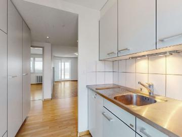 Modern Minergie apartment with glazed balcony, open kitchen & Reduit