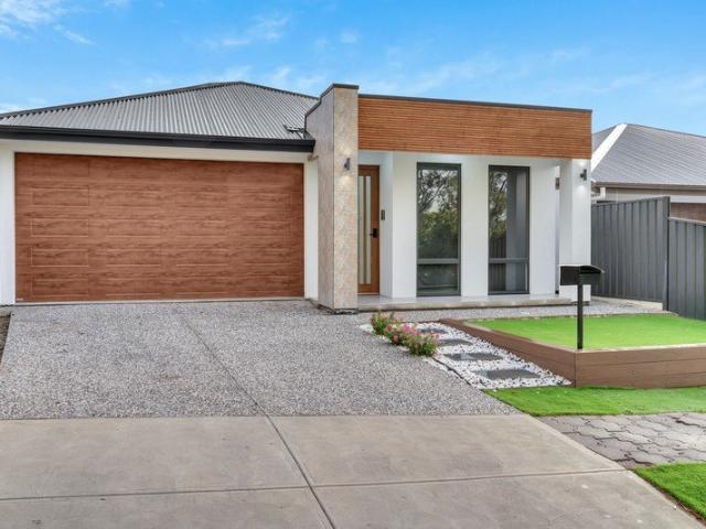 MODERN SINGLE LEVEL LIVING WITH STYLE, SPACE AND EASY CARE APPEAL