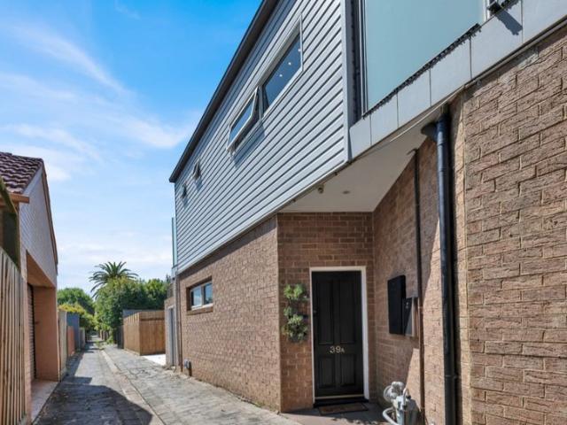 MODERN, SPACIOUS AND LOW MAINTENANCE LIVING ACCESS IS VIA THE LANEWAY