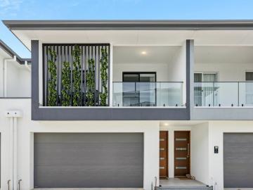 Modern, Spacious Design, Exciting Living, Double Garage & Walking Distance to the Beach!