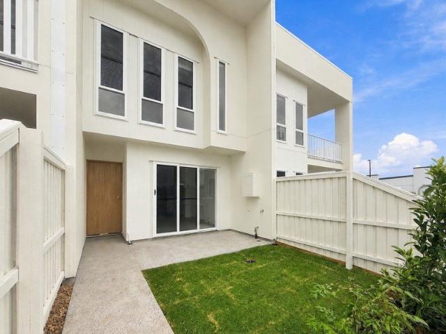 MODERN, SPACIOUS & LOW MAINTENANCE LIVING IN THE HEART OF AURA!