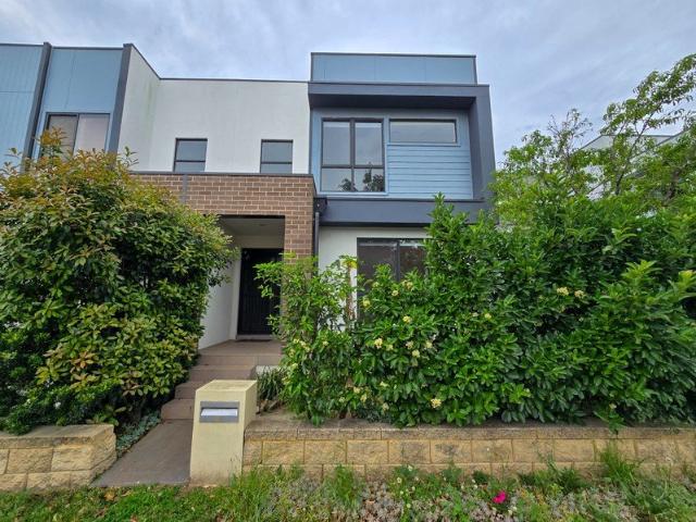 Modern Style & Effortless Living in Prime Catherine Field Location