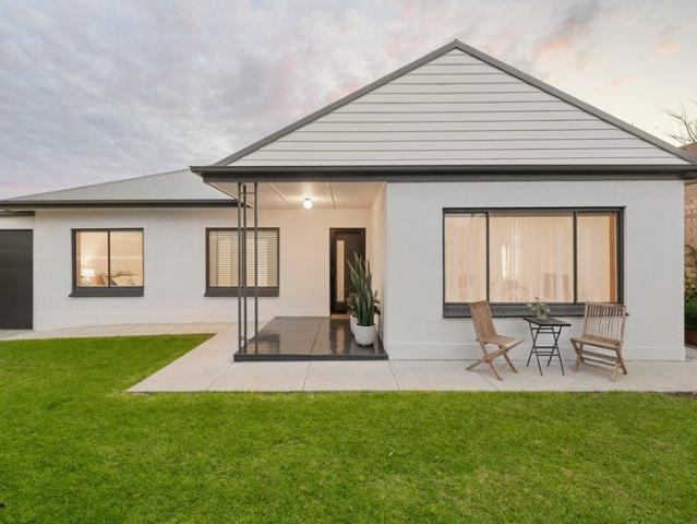 Modern Renovation Framed by Beautiful Established Gardens!