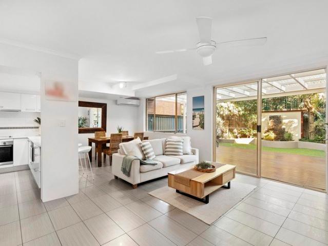 Modern town home with fabulous inside outside flow in serene setting