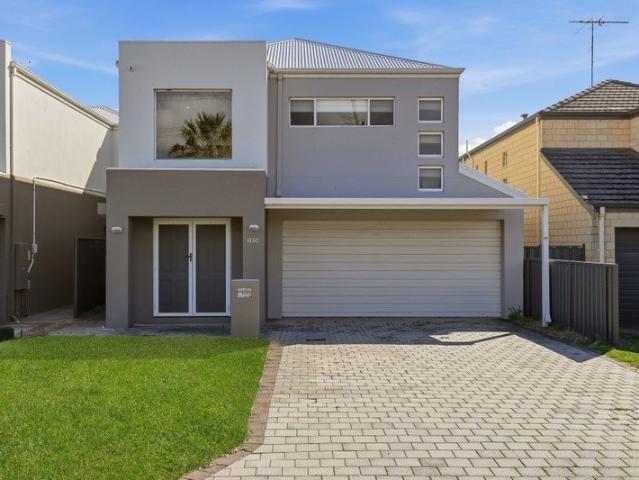 MODERN TOWNHOUSE LIVING JUST ONE STREET FROM THE BEACH