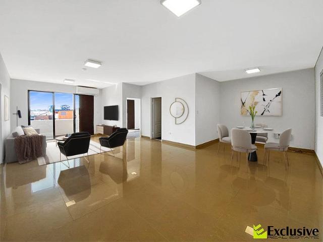 Modern Top Floor Apartment with District Views