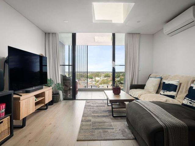 Modern top floor apartment living with uninterrupted district views