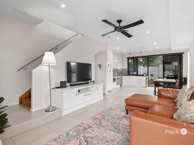 Modern three bedroom townhome with courtyard and city views