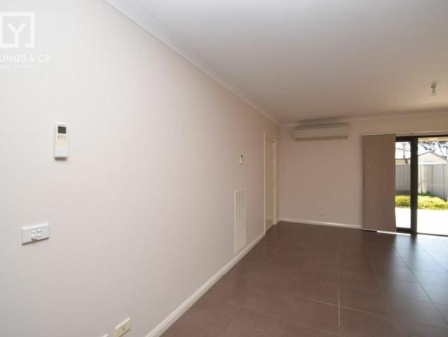MODERN THREE BEDROOM ON A LOW MAINTENANCE BLOCK