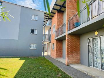 Modern two bedroom flat with one bathroom, featuring an open plan kitchen and lounge area