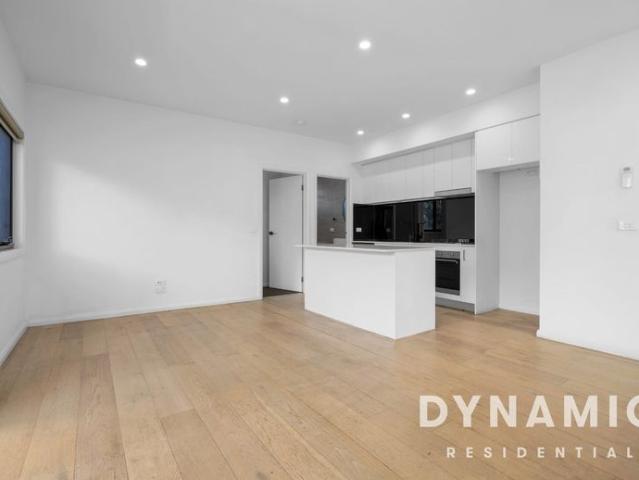 Modern Two Bedroom Townhouse with Private Front Yard in Prime Location!