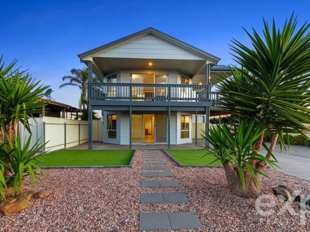 Modern two level living with Gulf views, excellent shedding and easy walk to the beach