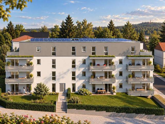 Moderne Eigentumswohnung mit Balkon, offenem Wohn und Kochbereich und Ankleide