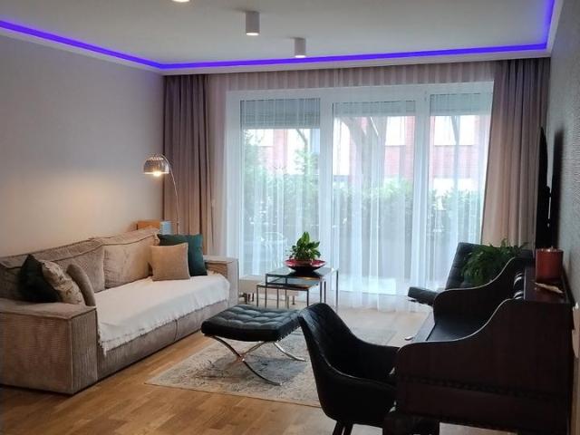 Moderne Eigentumswohnung mit Terrasse, Garten und Tiefgarage