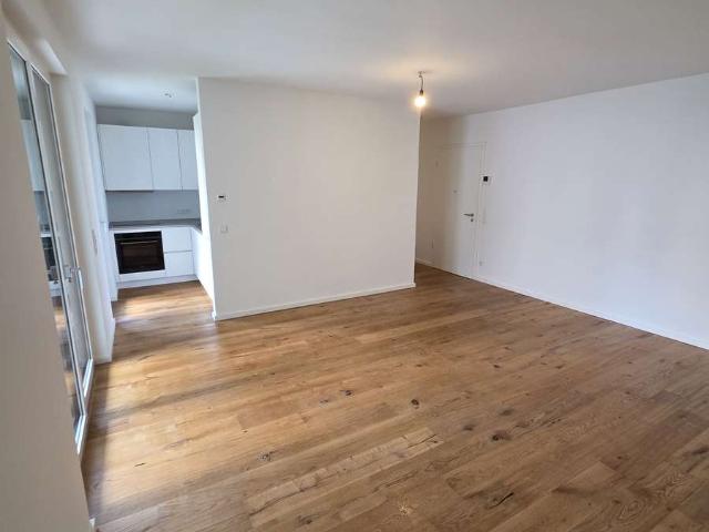 Moderne Erdgeschosswohnung mit Terrasse, Tiefgarage und hochwertiger Ausstattung in Rheinnähe