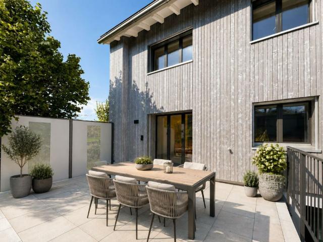 Moderne Wohnoase mit grosser Terrasse und eigenem Gartenanteil
