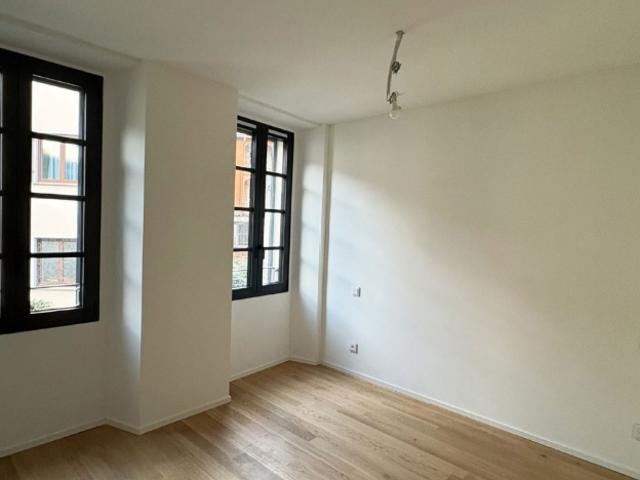 Moderne 3.5 Zimmer Erdgeschosswohnung mit Seesicht in Pura – Komfort in ruhiger Lage
