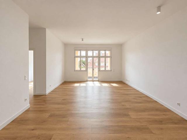Modernes Wohnen im André Noël Park: Großzügige 3 Zimmer Wohnung im Erdgeschoss mit Loggia