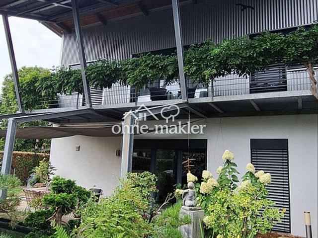 Modernes Rheinhaus mit PV Anlage, Wärmepumpe und pflegeleichten Garten