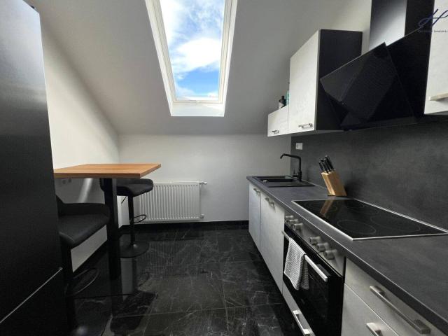 Modernisierte Dachgeschosswohnung mit Balkon & Blick auf die Burgruine Kirchschlag