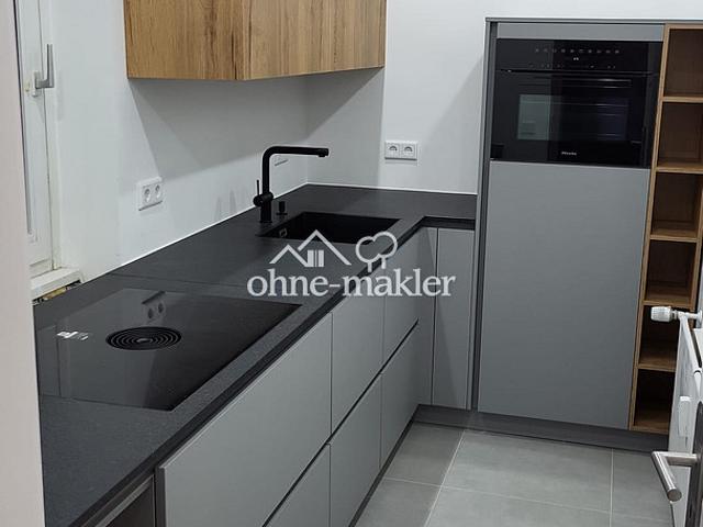 Modernisierte 2 Zimmer Wohnung mit saniertem Balkon, Miele Küche und Stellplatz in Erkrath Hochdahl