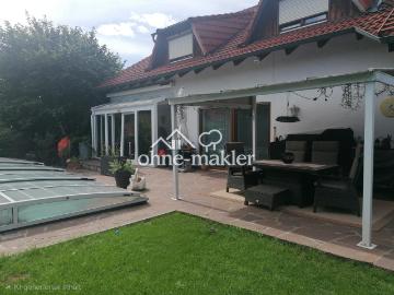 Modernisierte 5 Zimmer EG Wohnung mit Pool und direktem Garagenzugang