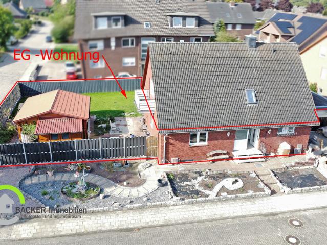 Modernisiertes Wohnen mit viel Grün – Erdgeschosswohnung mit Wintergarten und Garage