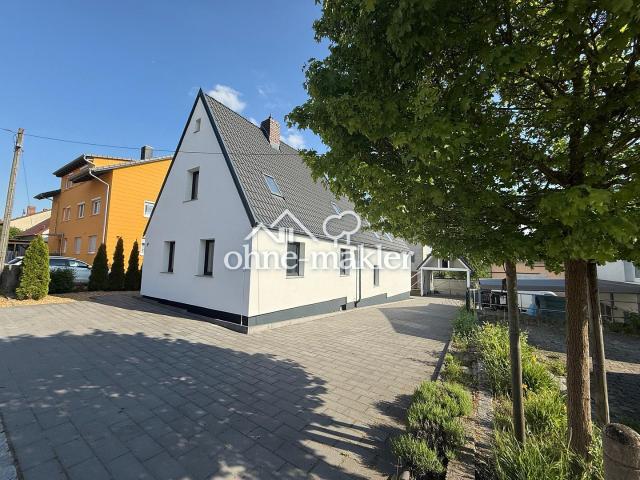 Modernisiertes Einfamilienhaus mit separatem Wohnbereich und großem Garten in Lonnerstadt