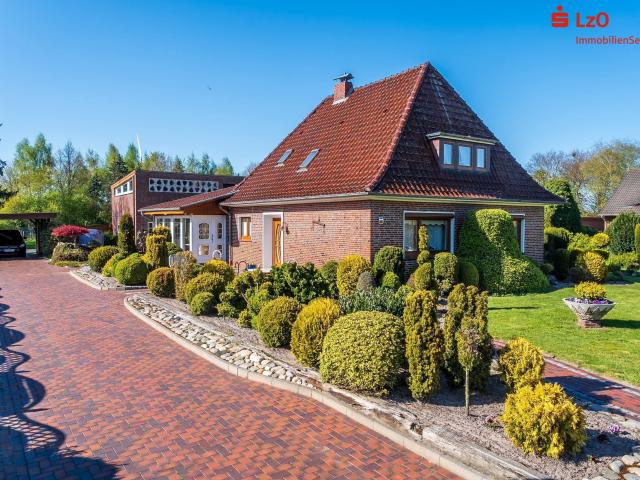 Modernisierter Bungalow mit Wintergarten und großem Garten in Augustfehn II