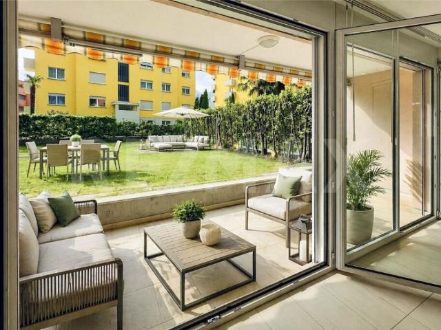 Moderno appartamento di 3.5 locali con giardino vicino ai negozi