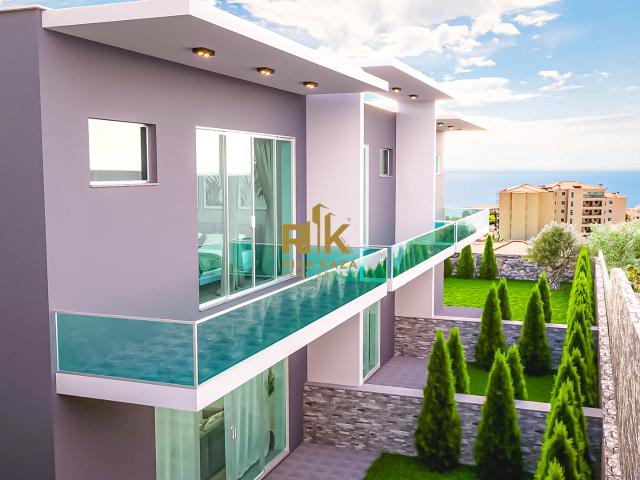 Moradia T3 em Banda Contemporânea com Jardim e vista mar