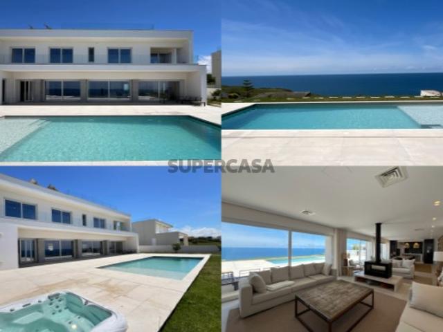 Moradia verdadeiramente exclusiva, onde o luxo, a tranquilidade e a imponência do oceano se unem numa localização privilegiada junto ao mar, com uma área de construção de 579 m², inserida num magnífico lote de 2.000 m²