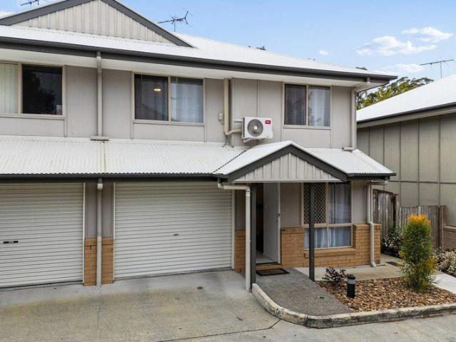 Move In Ready Townhome with Beautifully Landscaped Courtyard in a Quiet, Convenient Location