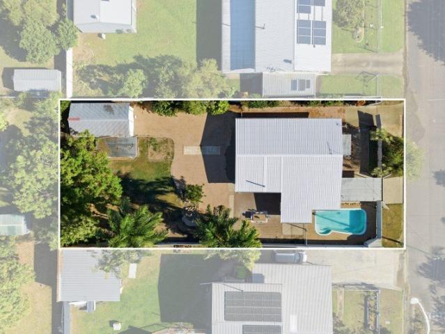 Move In Ready with a Sparkling Pool, Parking for the Boat or Trailer and a New Roof for Peace of Mind