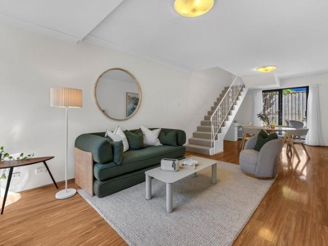 Move Straight In! Renovated Townhouse in Sought After Complex