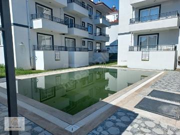 Muğla Ortaca Karaburun da Satılık Havuzlu 1+1 Daire