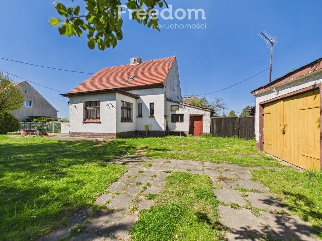 Dom 120 m² z garażem i pomieszczeniami gospodarczymi