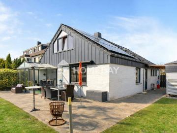 Nachhaltiger Wohntraum: Modernisiertes Familienidyll mit Wintergarten, Sauna & Wärmepumpe