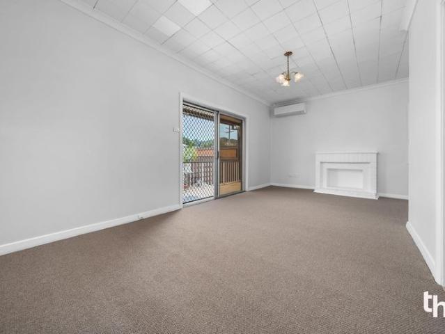 Neat & Newly Refreshed Home with Multiple Living Areas