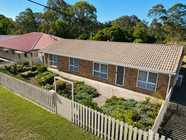 Neat as a Pin Brick 4 bedroon Home on Two Titles